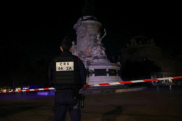 Paris bans protests as Macron swipes at Trump over riots